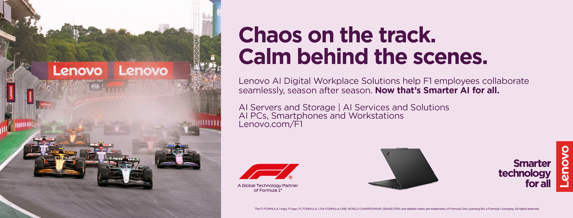 Lenovo advertisement with Formula 1 race cars and text on a track background